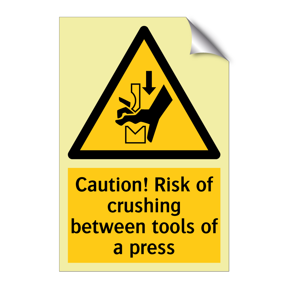 Caution! Risk of crushing between tools of a press